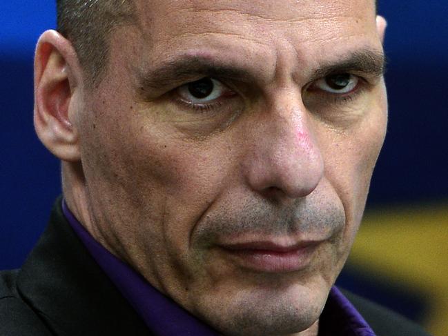 (FILES) -- A file photo taken on March 4, 2015 shows then Greek Finance Minister Yanis Varoufakis arriving to present his ministry's new secretaries at a press conference in Athens. Revelations by Greece's flamboyant former finance minister Yanis Varoufakis of secret plans for a parallel currency have sparked uproar in the country as the embattled leftist government on July 27, 2015 began to rebuild tattered trust with its international creditors. Kathimerini daily over the weekend reported that Varoufakis had revealed the plan to a group of London-based investors a few days after resigning his post on July 6. AFP PHOTO/LOUISA GOULIAMAKI