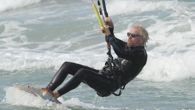 Richard Branson relaxes with some water-sports (kite-surfing and paddle boarding) during his visit to his Australian home, Makepeace Island. Picture: James Morgan