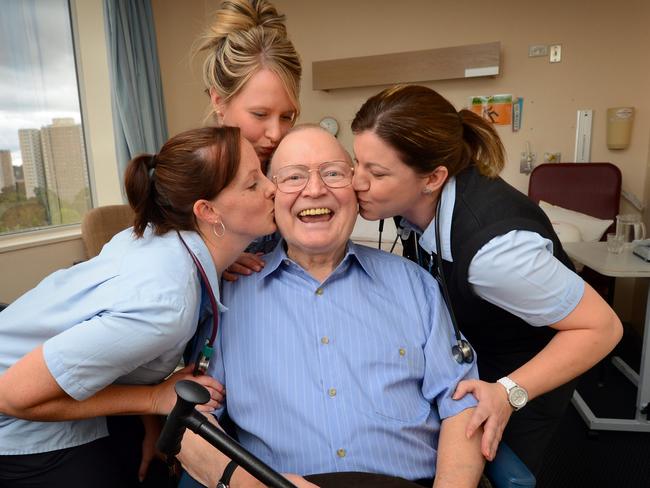 Bert gets a kiss goodbye from cardiac nurses Karlie Cooper, Janah Sweet and Melissa Santaera before leaving his hospital room after heart surgery in 2018. Picture: David Caird.