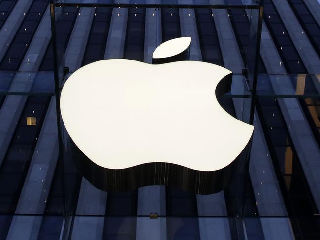 FILE - In this Sept. 5, 2014, file photo, the Apple logo hangs in the glass box entrance to the company's Fifth Avenue store in New York. Apple is appealing a European Union order to collect a record 13 billion euros ($14 billion) in taxes, following a similar appeal by Ireland. The move comes about four months after EU competition authorities said Apple owed back taxes based on the way it reports European-wide profits through Ireland. (AP Photo/Mark Lennihan, File)