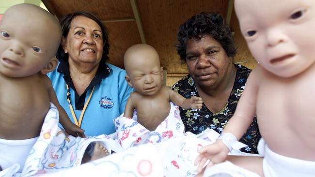 File photo in 2003 of Marilyn Wallace of Wujal Wujal &amp; Inez Carter from Apunipima Health Service with some dolls that display the effects of Foetal Alcohol Syndrome. Picture: Graham Crouch