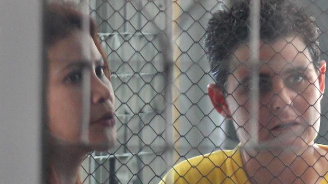 Bali Nine member Renae Lawrence, with her partner in the visiting room of Negara Detention House, has had her sentence reduced as part of Indonesia’s Independence Day celebrations.