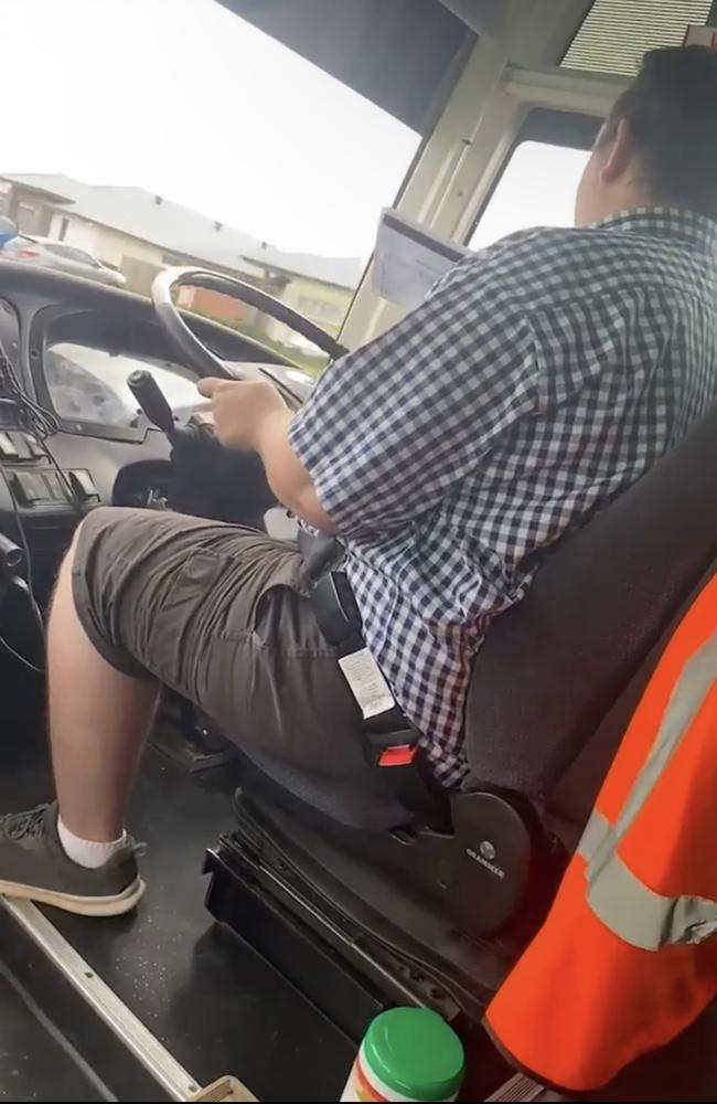 The bus driver was filmed apparently reading paperwork while driving.