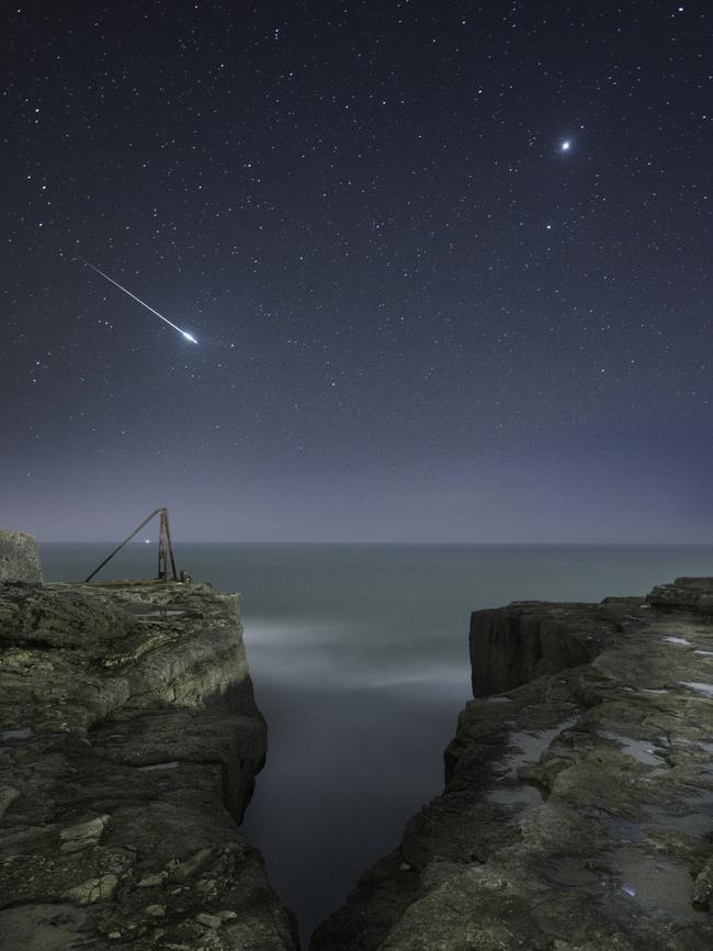 Insight Astronomy Photographer of the Year 2017 shortlist selection: Shooting Star and Jupiter . Picture: Rob Bowes (UK) A shooting star flashes across the sky over the craggy landscape of Portland, Dorset, as our neighbouring planet Jupiter looks on. The image is of two stacked exposures: one for the sky and one for the rocks. Portland, Dorset, UK, 25 March 2017
