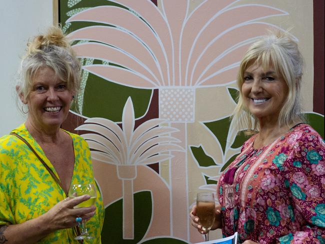 Wendy Hanna and Sharlene Cheetham stand in front of Wendy's painting.