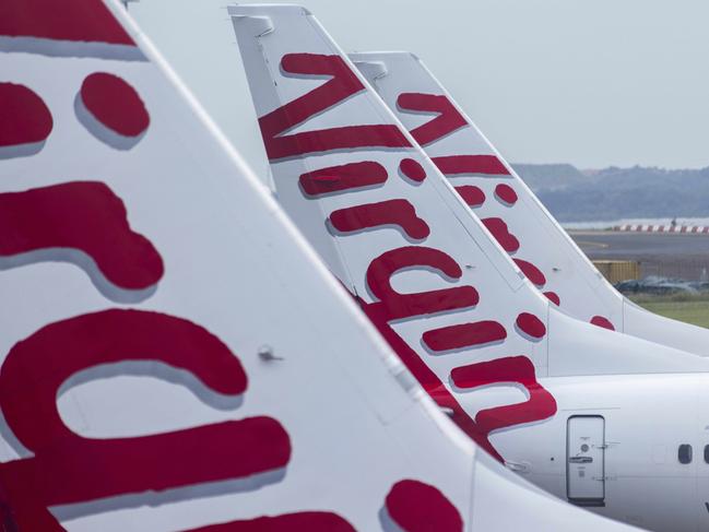 SYDNEY, AUSTRALIA - NewsWire Photos FEBRUARY 06, 2021: A general view of the tails of Virgin Australia planes at Sydney Domestic airport.  Picture: NCA NewsWire / Jenny Evans