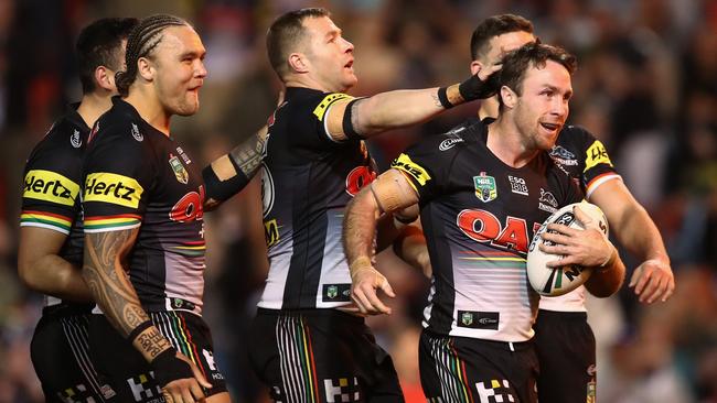 James Maloney celebrates with Panthers teammates after scoring a try. Picture: AAP