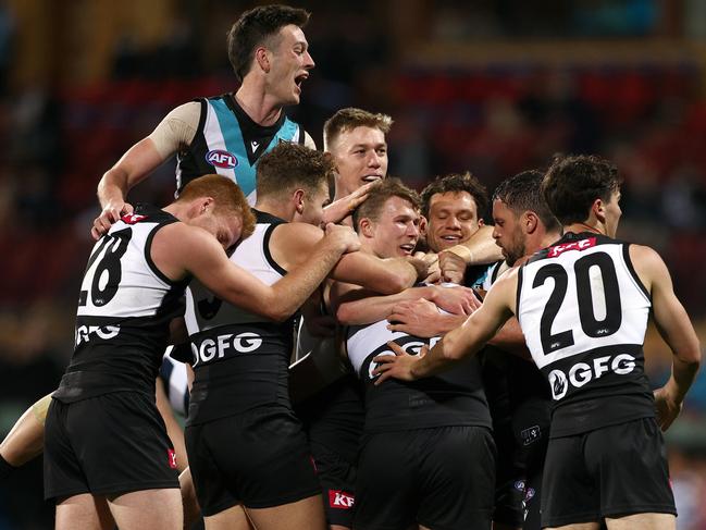 Powell-Pepper is surrounded by his teammates after kicking a goal having come on to the ground as a medical sub in the Qualifying Final on August 27. Picture: Getty