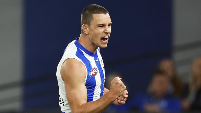 MELBOURNE, AUSTRALIA - AUGUST 20: Luke Davies-Uniacke of the Kangaroos celebrates kicking a goal during the round 23 AFL match between the North Melbourne Kangaroos and the Gold Coast Suns at Marvel Stadium on August 20, 2022 in Melbourne, Australia. (Photo by Daniel Pockett/Getty Images)