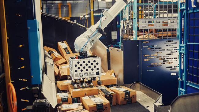 Cardinal, one of Amazon's trio of AI-powered robotic arms — that can sort, stack, and consolidate millions of items and customer orders with precision.