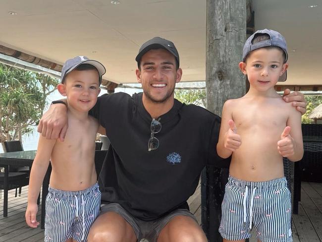 Nick Daicos with Taylor Walker's sons in Fiji. Picture: Supplied