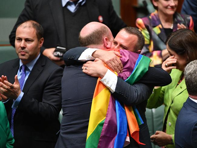 Liberal Member for North Sydney Trent Zimmerman and Liberal Member for Goldstein Tim Wilson celebrate the passing of the Marriage Amendment Bill. Picture: AAP