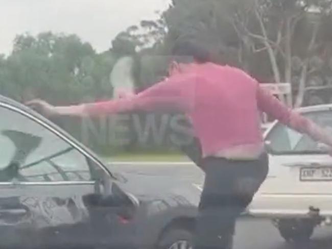 A shocking road rage attack has been captured on camera at Elizabeth, Adelaide, showing a woman kicking a side mirror before using it to smash a driver’s window. Picture: 9News,