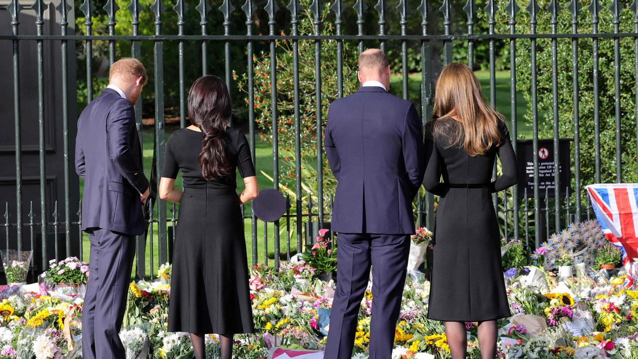 Harry, Meghan, William and Kate look at floral tributes for the Queen at Windsor Castle. Picture: Chris Jackson/AFP