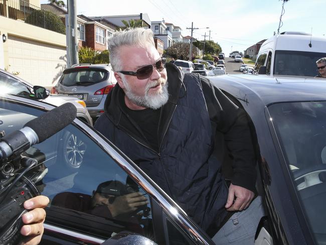 Kyle Sandilands turns up at John Ibrahim’s house in Dover Heights while police search it, but is turned away. Picture: Justin Lloyd