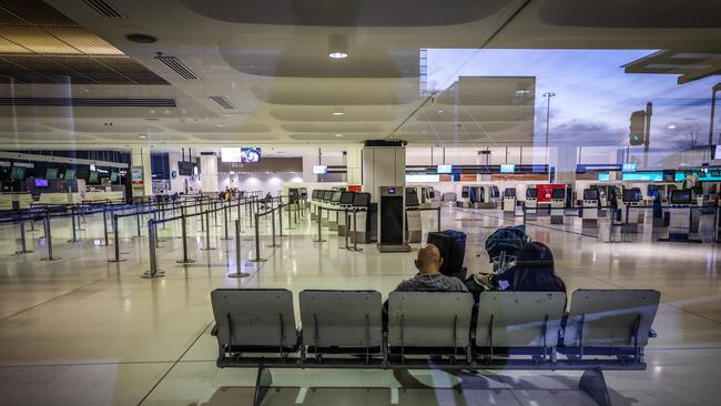 Passengers waiting in the departures area of the Sydney International Airport on Tuesday. Picture: AFP