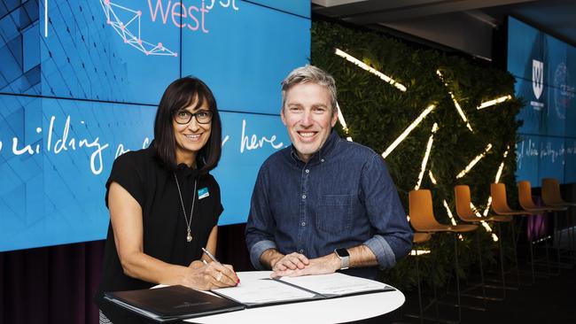 Campbelltown City Council General Manager Lindy Deitz and WSU Assistant Vice-Chancellor Andy Marks signing the MOU. Picture: Sally Tsoutas.