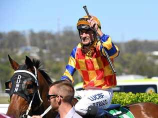 WINNING SALUTE: Jockey Robbie Fradd enjoys his win aboard The Fire Trap at Ipswich racetrack. Picture: Rob Williams