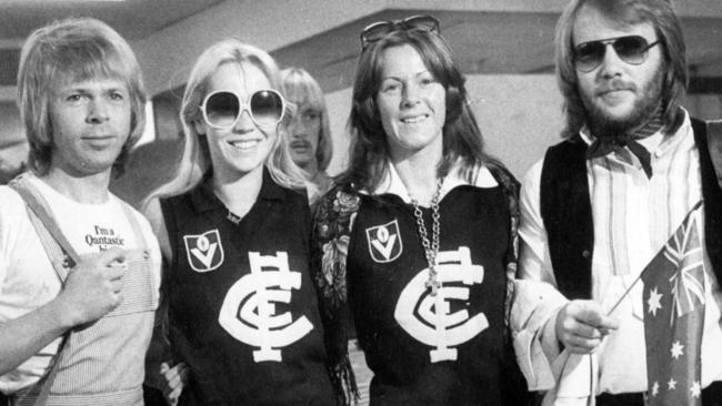 ABBA band members Agnetha and Frida wear Carlton football jumpers.