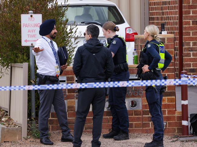 Police swarm the scene. Picture: Ian Currie