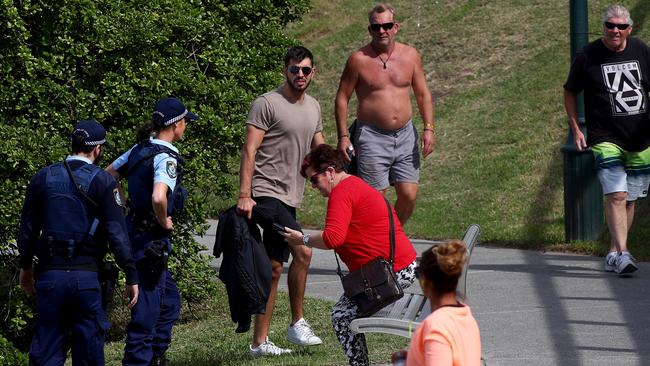 Police move on people around the Bronte Beach area yesterday. Picture: Toby Zerna