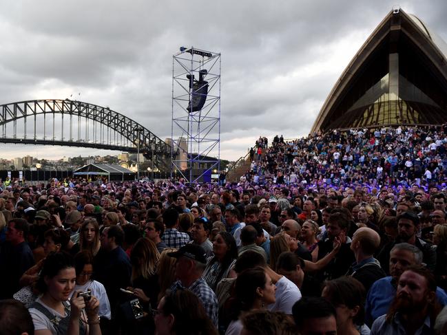 Crowds gather ahead of Crowded House performing their 20th anniversary show at the Sydney Opera House, in Sydney, Thursday, Nov. 24, 2016. Today marks 20 years since the band played their farewell show to tens of thousands of people at the Sydney Opera House forecourt, and are celebrating the occasion with three performances at the iconic location. (AAP Image/Dan Himbrechts) NO ARCHIVING