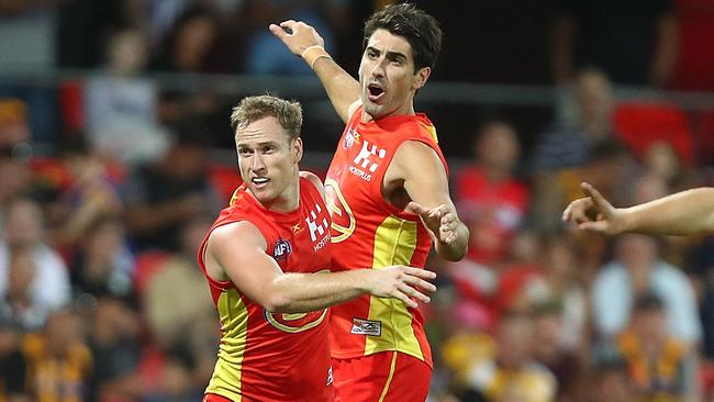 Brandon Matera and Matt Rosa celebrate a goal against Hawthorn.