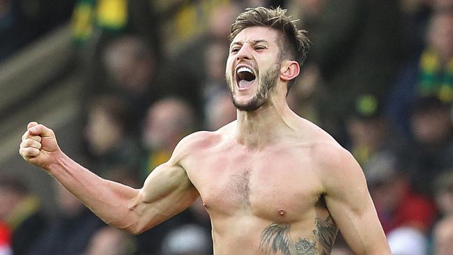 With his shirt off, Liverpool's English midfielder Adam Lallana celebrates.