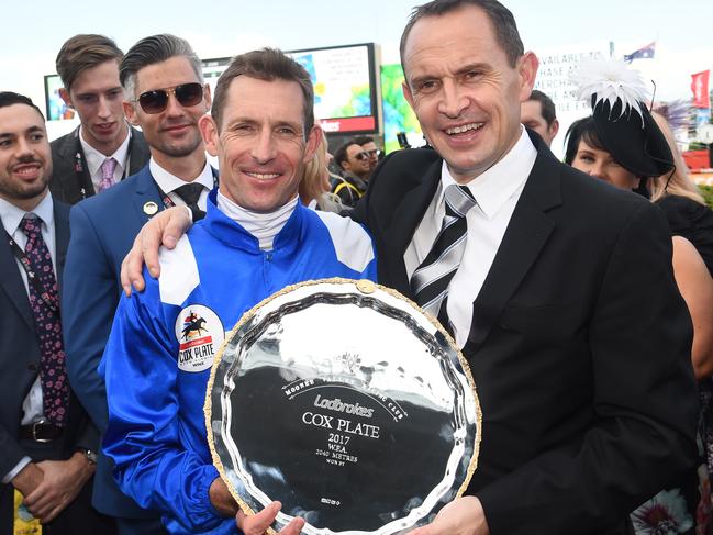 Hugh Bowman and trainer Chris Waller with last year’s Cox Plate trophy.