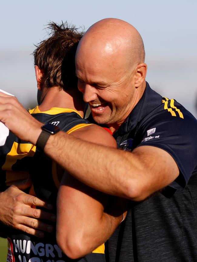 Matthew Nicks hugs Matt Crouch of the Crows. Photo by Dylan Burns/AFL Photos via Getty Images.