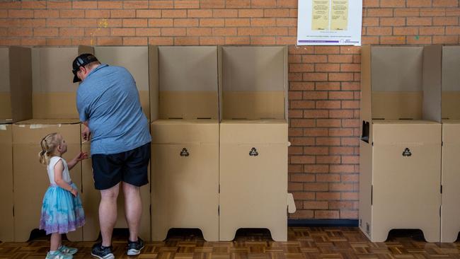 A voter cast his vote at a polling centre at Stan Thiess Memorial Centre in Melbourne.