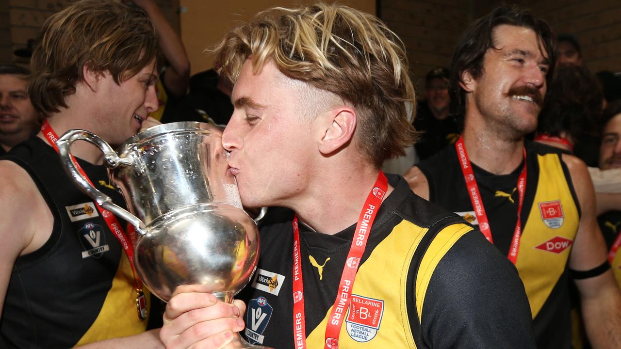 Torquay’s Baxter Mensch with the 2024 BFNL premiership cup. Picture: Mark Wilson