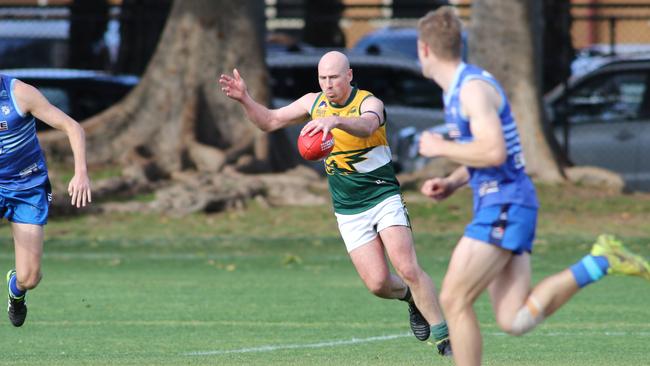 Salisbury North player/coach Joe Hay in action against Sacred Heart. Picture: AAP/Russell Millard