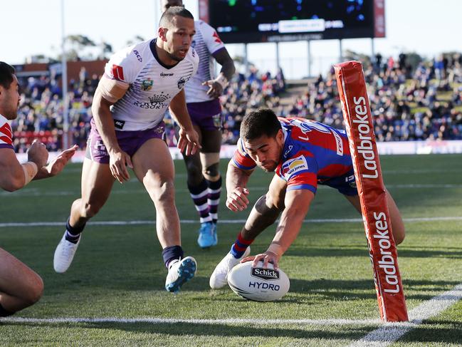 Ken Sio scores during his time at the Newcastle Knights. AAP Image/Darren Pateman