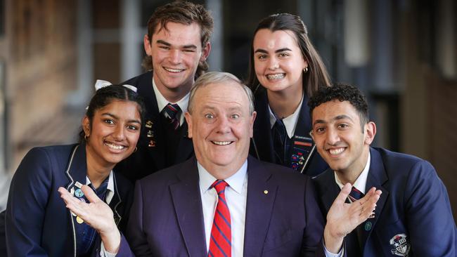 Mr Costello with some of the children whose parents scored his baby bonus 18 years ago: Kaniha 17, Peter 17, Amelia 18 and Marcellino 18, all born in 2005 Picture: David Caird