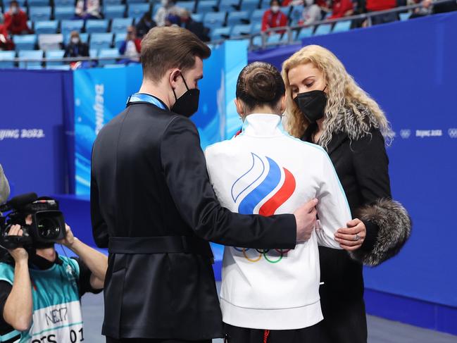 Kamila Valieva of Team ROC is confronted by choreographer Daniil Gleikhengauz (L) and coach Eteri Tutberidze (R) after the Women Single Skating Free Skating. Picture: Matthew Stockman/Getty Images