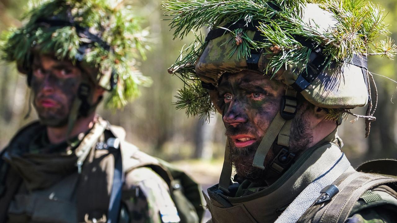 Members of the MPK, the National Defence Training Association of Finland, attend a training at the Santahamina military base in Helsinki, Finland on May 14, 2022.(Photo by Alessandro RAMPAZZO / AFP)