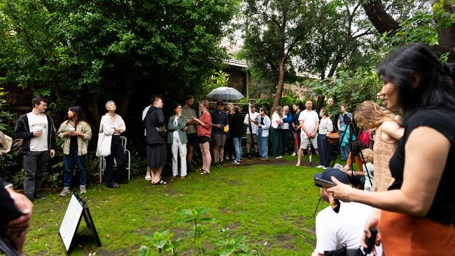 The crowd was silent as a buyer opened with a bid of $1.2m after the property had a guide of $950,000. Photo: Francis Sicat