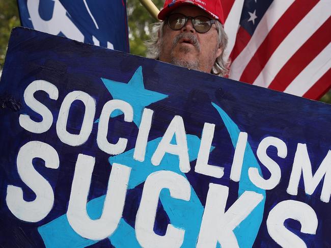 COCONUT CREEK, FLORIDA - OCTOBER 29: Robert Korhonen and other supporters of President Donald Trump demonstrate together outside where Democratic presidential nominee Joe Biden is holding a campaign rally at the Broward College North Campus on October 29, 2020 in Coconut Creek, Florida. President Trump and Mr. Biden continue to campaign across the country before the November 3rd election.   Joe Raedle/Getty Images/AFP == FOR NEWSPAPERS, INTERNET, TELCOS & TELEVISION USE ONLY ==