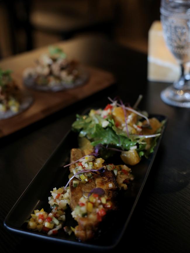 Roast achiote pork belly with pineapple pico de gallo.