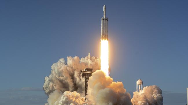 A SpaceX Falcon Heavy rocket lifts off from the Kennedy Space Centre in Cape Canaveral yesterday. Picture: AP