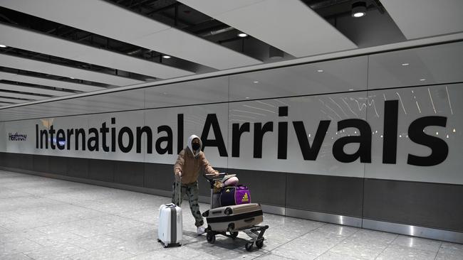 A passenger arrives at a relatively deserted Heathrow Airport in London. Picture: AFP