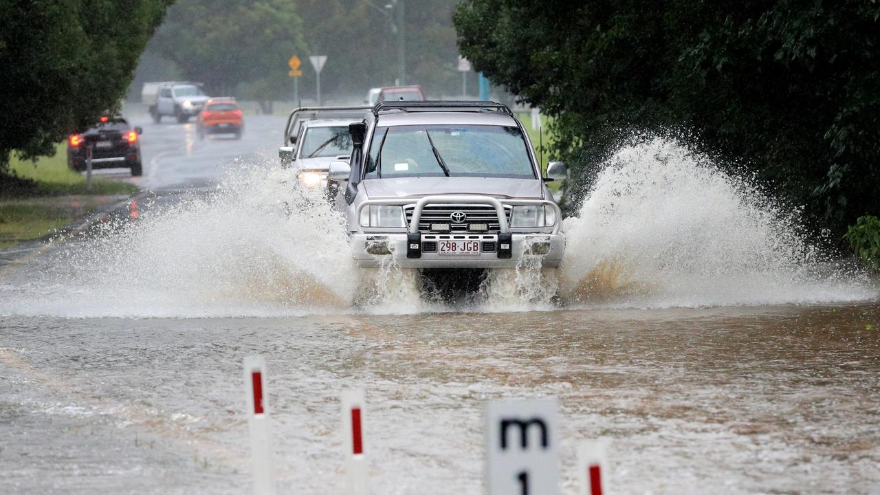 Drivers ignore rising flood water across Tallebudgera Connection Road, Tallebudgera. Picture: Scott Powick