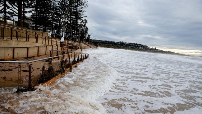 Further south at Dee Why the beach disappeared in the large swell. Picture: Annika Enderborg