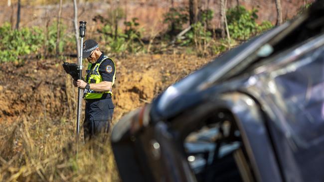 NT Police mark out the scene on the Stuart Hwy in front of the crash wreckage at Manton Dam. Picture: Floss Adams. GENERIC NT CRASH IMAGE