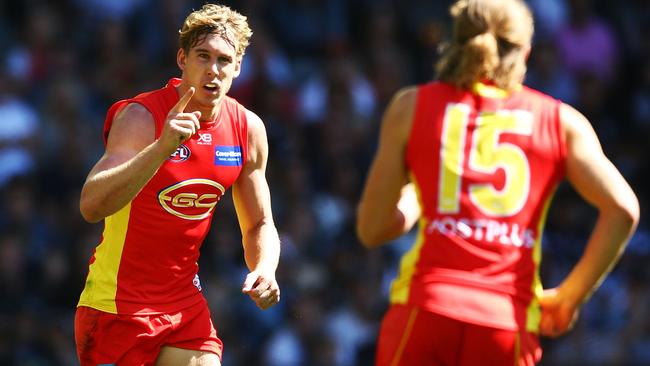 Tom Lynch celebrates a goal with Aaron Young.