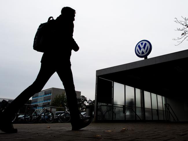 A man arrives at the Volkswagen factory in Wolfsburg, central Germany. Several engineers admitted to installing the device in the company's cars aimed at cheating pollution tests. Picture: AFP / DPA / Julian Stratenschulte