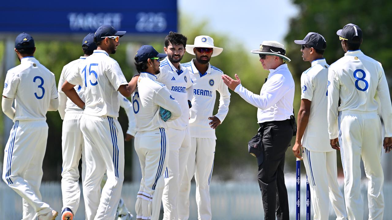 A match umpire speaks to players of India A before commencement of play during day four of the match between Australia A and India A. (Photo by Albert Perez/Getty Images)