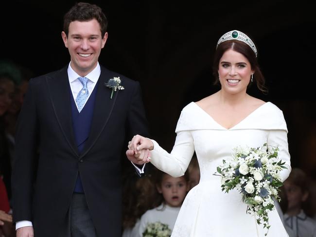 WINDSOR, ENGLAND - OCTOBER 12: Princess Eugenie of York and her husband Jack Brooksbank on the steps of St George's Chapel after their wedding at St. George's Chapel on October 12, 2018 in Windsor, England. (Photo by Steve Parsons - WPA Pool/Getty Images)