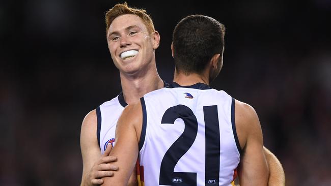 Tom Lynch celebrates a goal with Rory Atkins in Adelaide’s win over St Kilda on Saturday. Picture: Julian Smith (AAP).